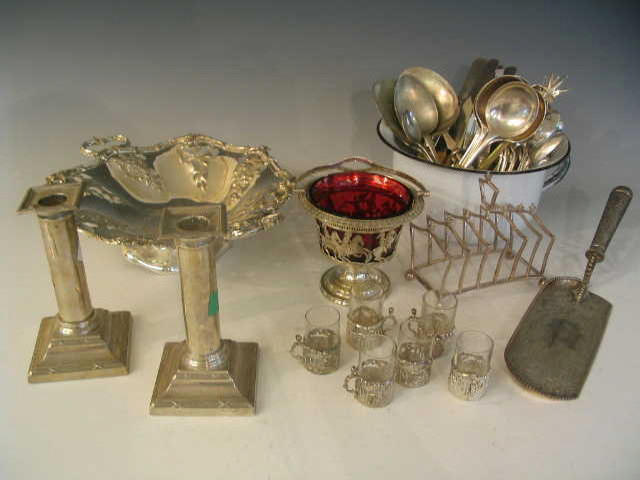 A quantity of silver and plated items to include a pair of silver Candlesticks, together with other metalwares (qty),