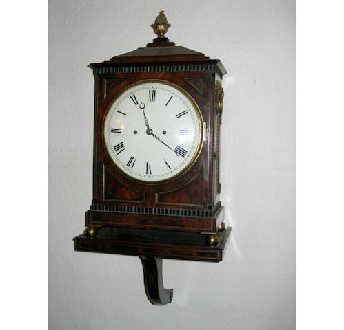A Regency mahogany, part ebonised and brass mounted bracket clock; together with a matching bracket.