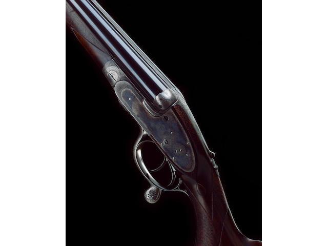 A FINE .303 DOUBLE-BARRELLED HAMMERLESS SELF-OPENING SIDELOCK NON-EJECTOR RIFLE BY J. PURDEY, NO. 15451 In its brass-mounted oak and leather case