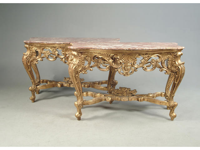 A pair of Louis XV style carved giltwood console tables