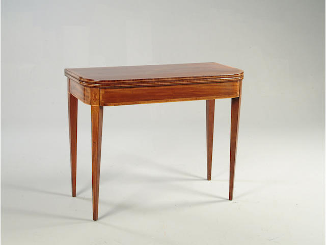 A George III mahogany cross banded and boxwood strung tea table