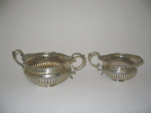 A late Victorian sugar bowl and cream jug, maker's mark "C.H", Birmingham, 1900,