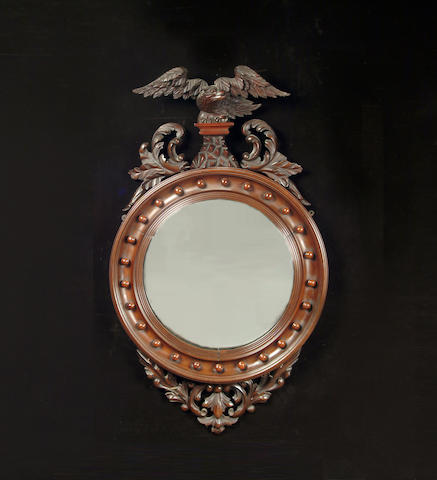 A Regency style mahogany convex mirror