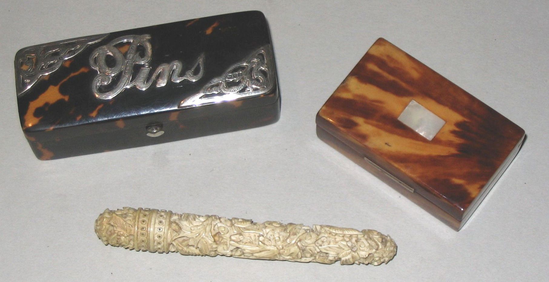 A rectangular tortoiseshell pin box,