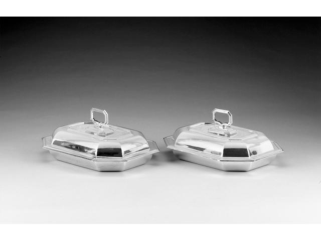 A pair of silver entr&#233;e dishes and covers with detachable handles, by Mappin & Webb, Sheffield 1930 - 1931,