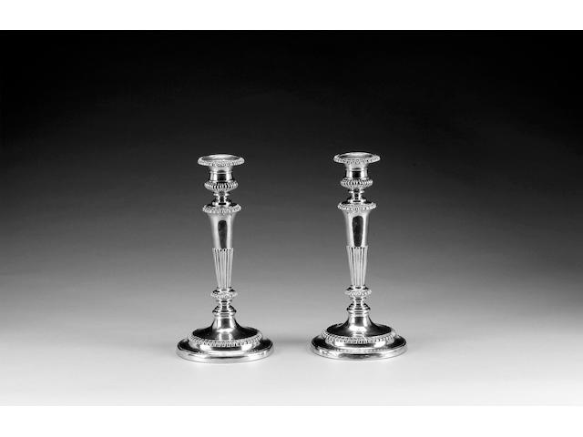 A pair of George III silver candlesticks, by J. & T. Settle, Sheffield 1816,