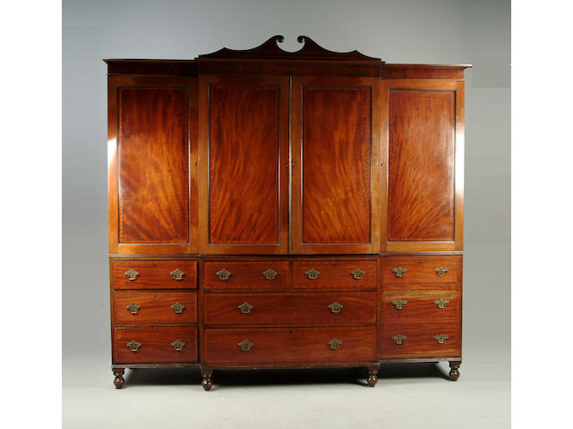 A late George III mahogany and satinwood inlaid wardrobe