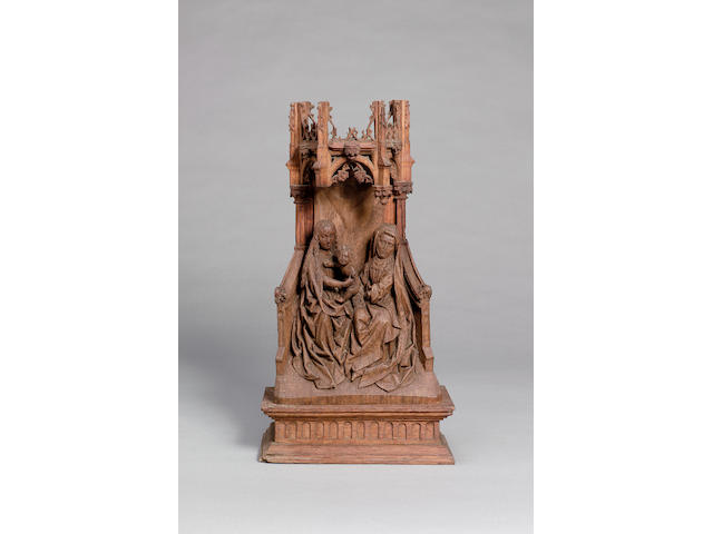 A Northern European carved oak figural group of  the seated Virgin and child and St Anne