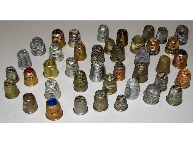 Sixty six various thimbles in metal,