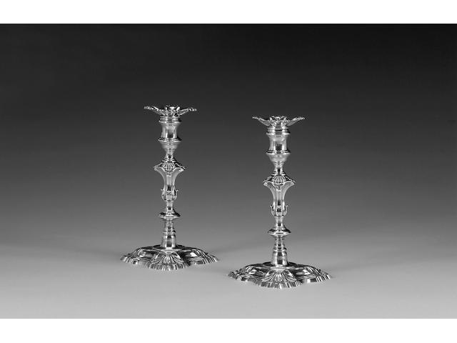 A George II pair of cast silver candlesticks, by Jacob Marsh, London 1751,