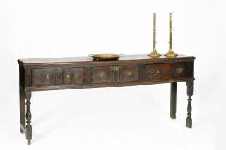A late 17th Century oak low dresser,