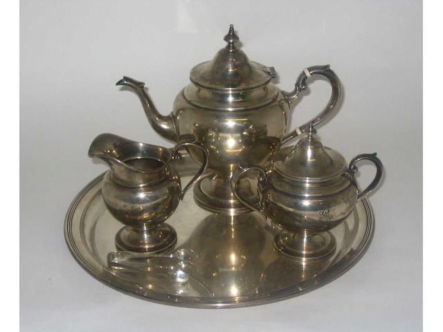 An early 20th Century three piece tea set and matching tray, by Gorham and Co, stamped "Sterling",