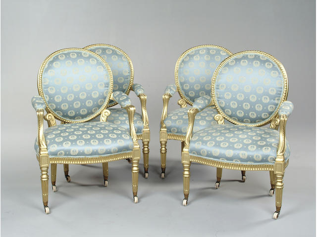 A set of four Adam style giltwood armchairs