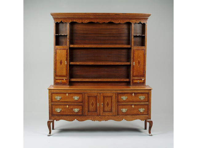 An 18th century style oak and walnut banded dresser