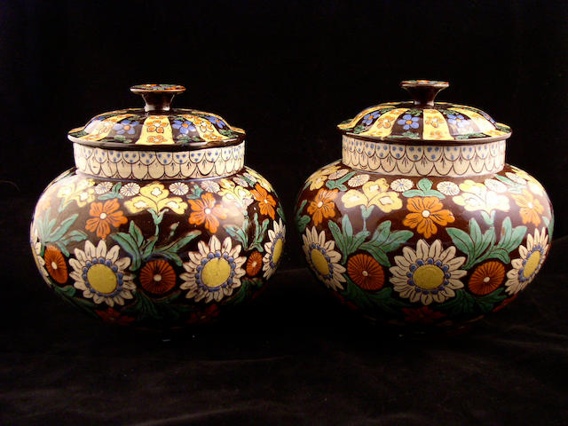 A pair of Thoune pottery vases and covers, 19th Century,