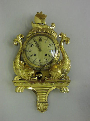 An early 20th Century Continental giltwood cartel wall clock,