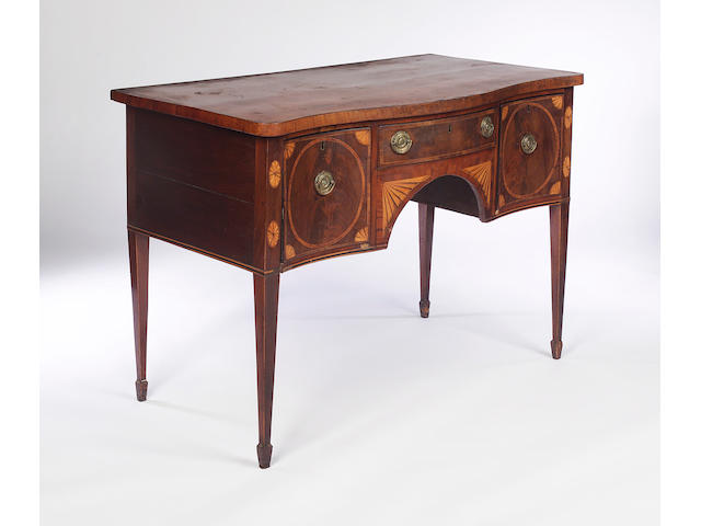 A George III mahogany and marquetry inlaid serpentine fronted Sideboard,