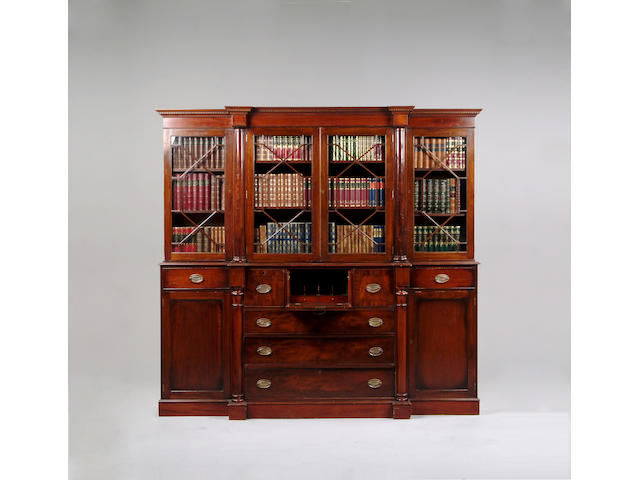 A George III style mahogany breakfront secretaire bookcase