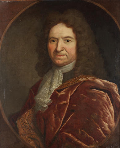 French School, Early 18th Century Portrait of a gentleman, bust-length, with a scarlet coat with gold brocade lining and a lace jabot, in a painted oval, 72 x 59 cm (28&#188; x 23&#188; in)