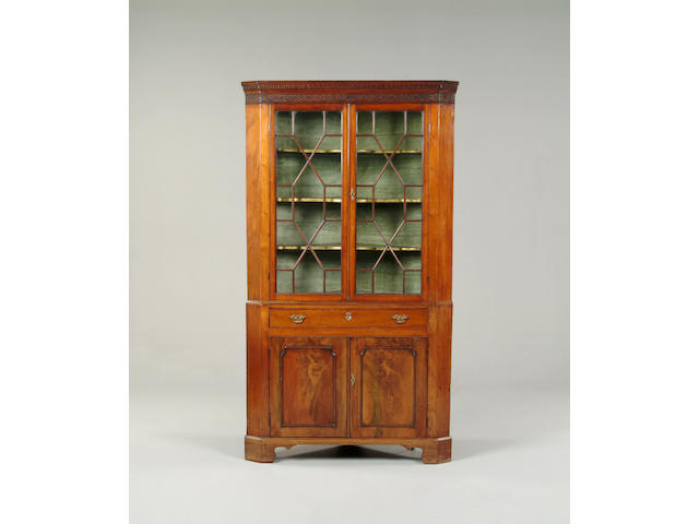 A George III mahogany corner cabinet