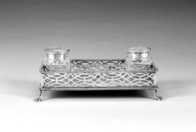 A George III silver rectangular two bottle inkstand, by S. Herbert & Co., London 1769,