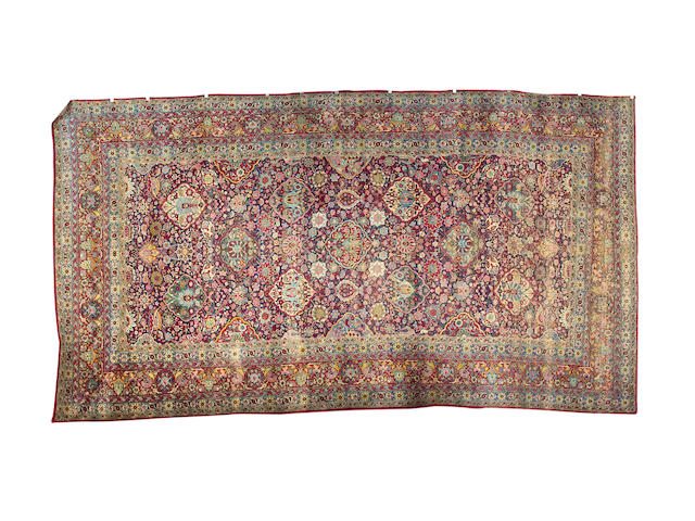 A Kirman carpet South East Persia, 20 ft 2 in x 10 ft 10 in (614 x 329 cm)