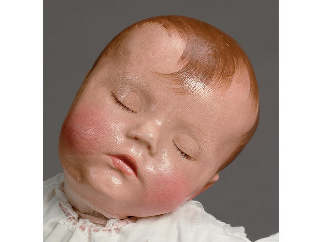 'Traumerchen' Kathe Kruse sand baby, German circa 1930 These dolls were inspired by Kathe Kruse after the birth of her son Max in 1922, and  were used in hospitals as training aids for new mothers.