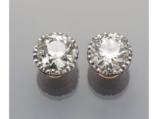 An impressive pair of diamond single-stone earclips,