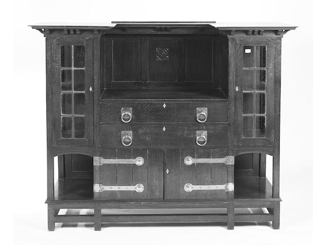 E. A. Taylor, in the manner of, An Arts and Crafts oak cabinet,
