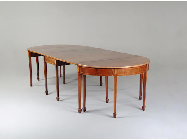 A George III mahogany and tulipwood banded D-end dining table
