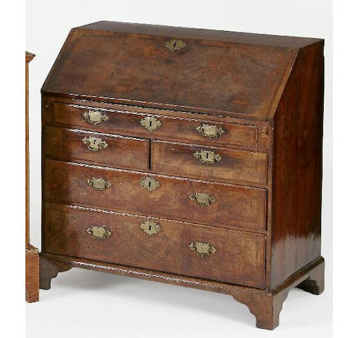 A mid 18th Century walnut bureau with narrow oblique banding and cross banding,