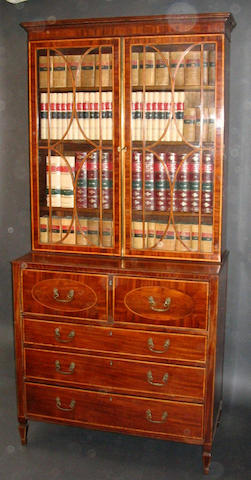 A George III Sheraton design mahogany, satinwood crossbanded and line inlaid secretaire bookcase