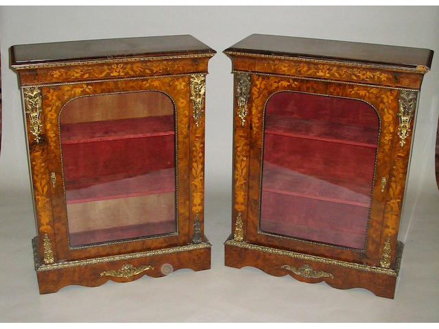 A pair of mid-19th Century Louis XV style burr walnut, floral marquetry, gilt brass and metal mounted side cabinets