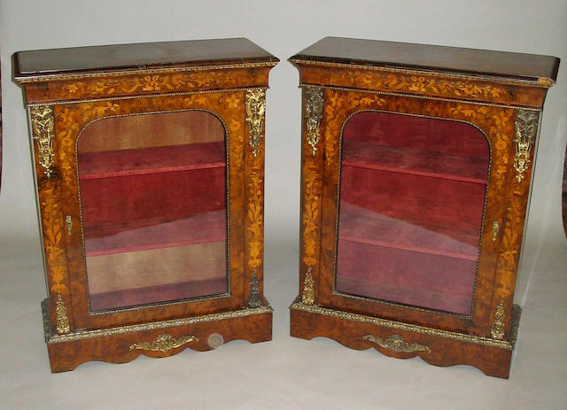 A pair of mid-19th Century Louis XV style burr walnut, floral marquetry, gilt brass and metal mounted side cabinets