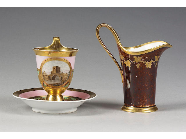A signed Berlin mosaic cabinet cup and saucer, circa 1810, and a Sevres milk jug, circa 1800,