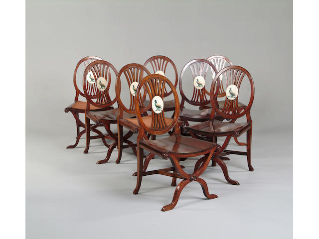 A set of eight George III style mahogany hall chairs