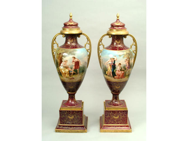 A large pair of Vienna style vases and covers