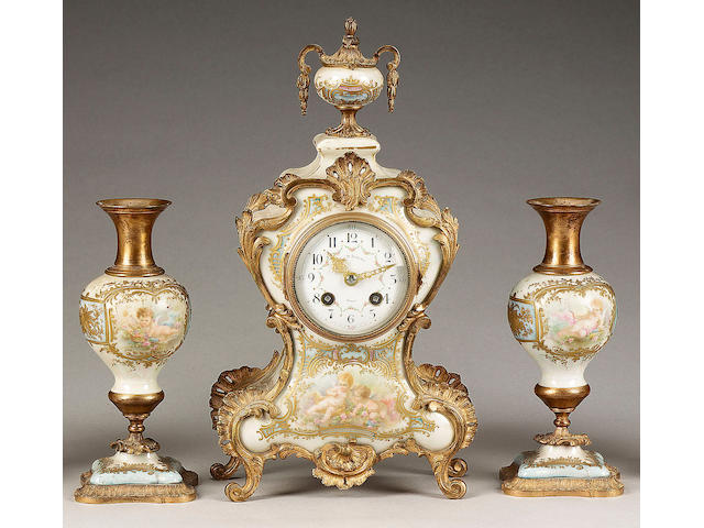 A gilt metal mounted Continental porcelain clock garniture, circa 1890,