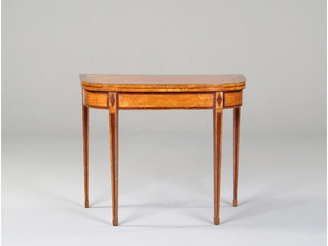 A George III satinwood and mahogany crossbanded card table