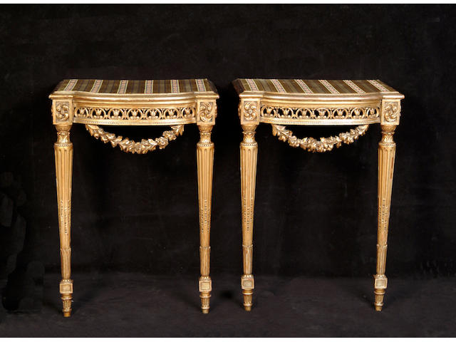 A pair Louis XVI style giltwood console tables,