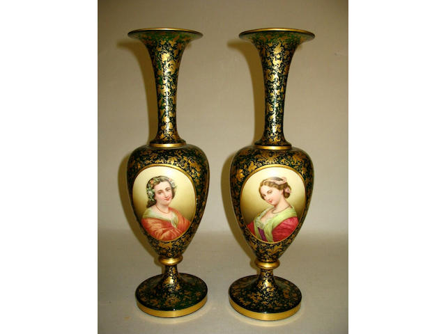 A pair of Bohemian green glass overlay vases