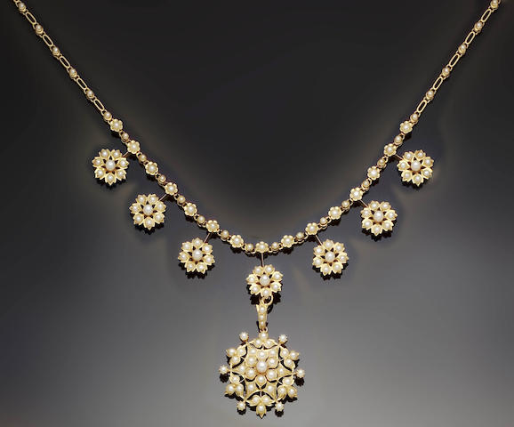 An Edwardian gold and seed-pearl necklace, retailed by J.W Benson of London