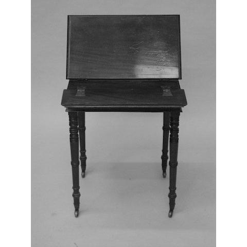 An early 19th Century mahogany reading table,