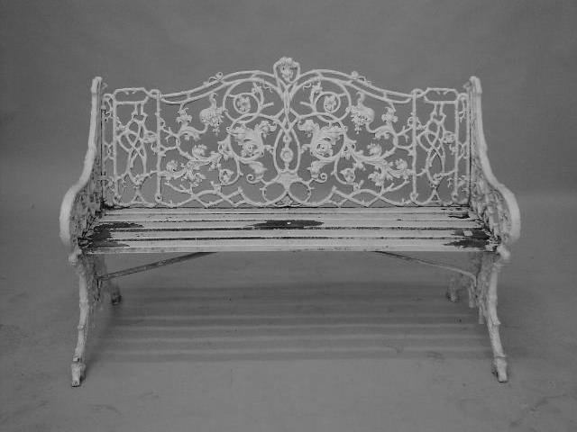 A Victorian white painted cast iron garden seat,