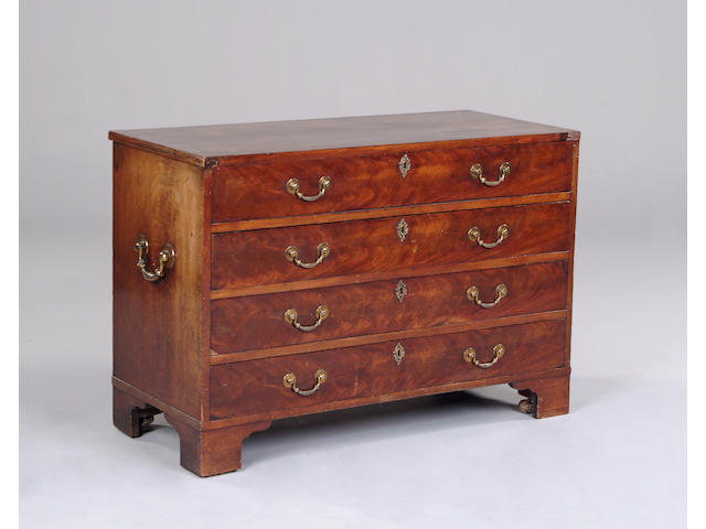 An early 19th century mahogany campaign chest of drawers