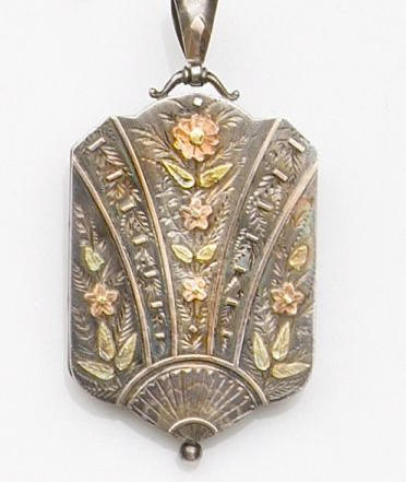 A Victorian silver Aesthetic movement locket, (2)