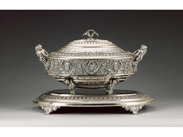 A 20th century Spanish metalware soup tureen with mirror plateau,