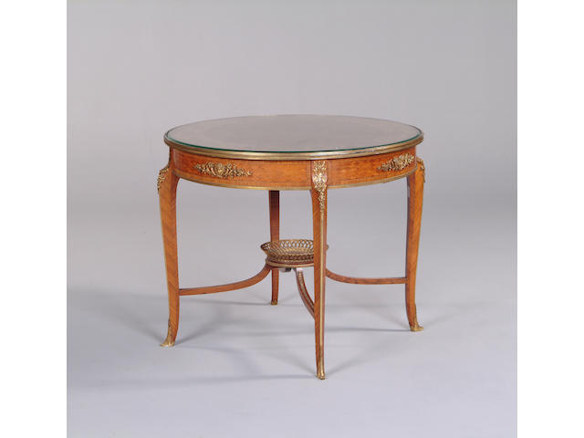 An early 20th century kingwood, tulipwood, parquetry and ormolu mounted centre table by Francois Linke