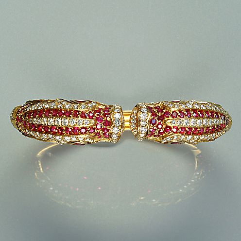 A diamond and ruby-set hinged bangle