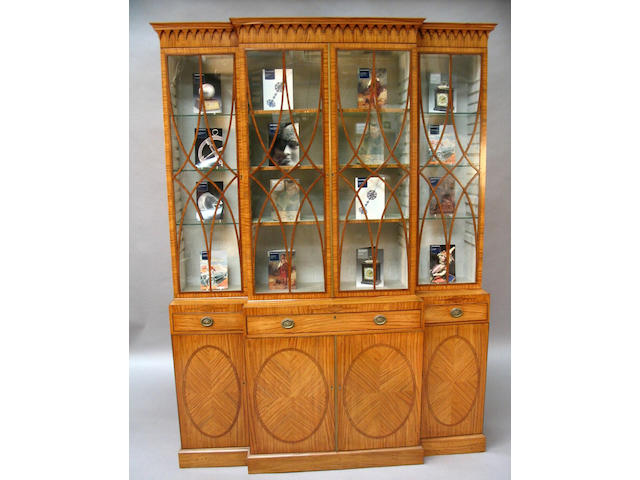 A satinwood, kingwood crossbanded and line inlaid breakfront bookcase